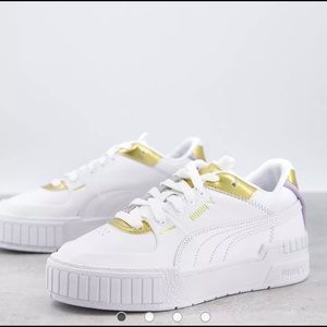 Puma Cali Sport sneakers in white and gold